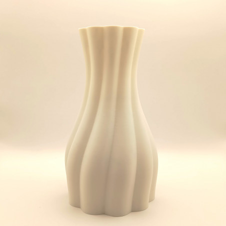 Un vase aux courbes tendres, avec verre intérieur, pour sublimer vos fleurs et illuminer votre intérieur.